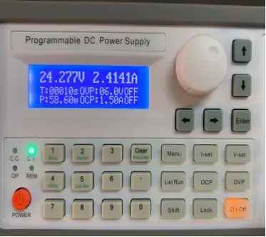 Power supply showing 58.60W during an anonymous LED strip voltage-drop test